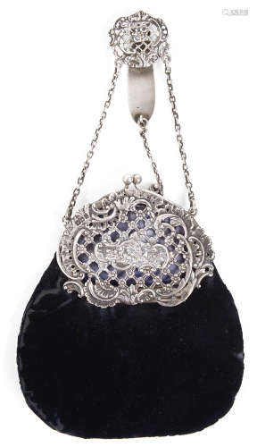 A late Victorian silver mounted blue velvet chatelaine purse,