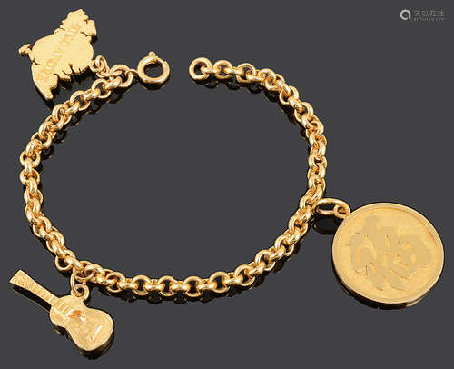 An Oriental yellow metal charm bracelet