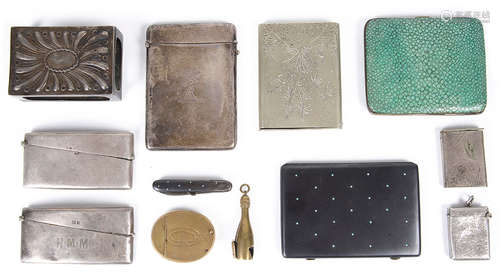 A late Victorian William Comyns silver match box cover, silver card cases and other items