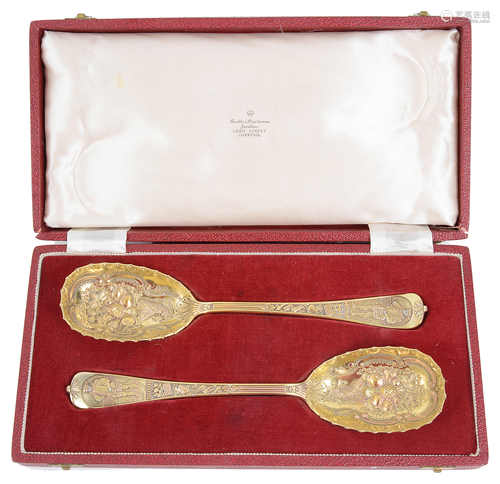 A pair of late Victorian silver gilt berry spoons