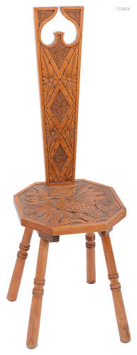 An Arts and Crafts Welsh carved satin walnut spinning chair