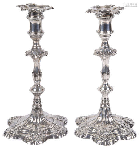 A pair of George II silver candlesticks