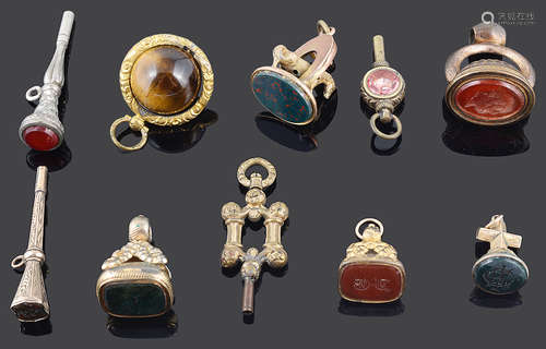 A collection of 19th Century watch keys and pendant fobs