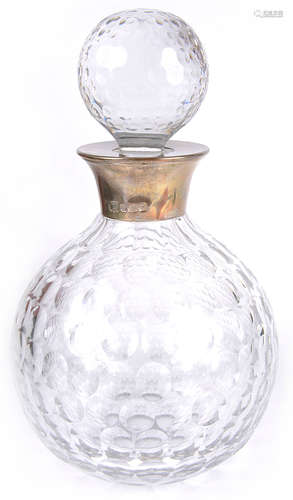 A contemporary silver mounted decanter