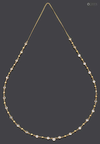 A Continental yellow metal and white sapphire necklace