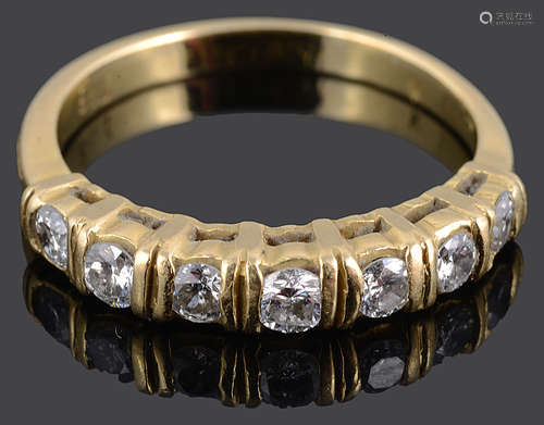 A Continental seven stone diamond set half eternity ring