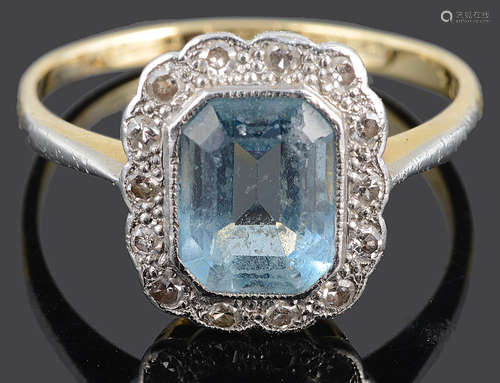 A blue gem and diamond set cluster ring