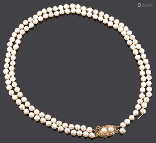 A double row cultured pearl necklace with Chinese yellow metal pearl set fancy clasp