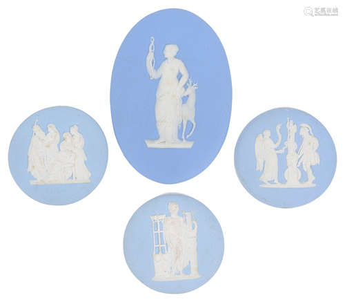 Four early 20th Century Wedgwood blue jasperware plaques