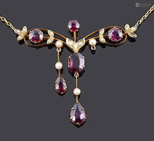 A delicate Edwardian garnet and seed pearl set scroll necklace