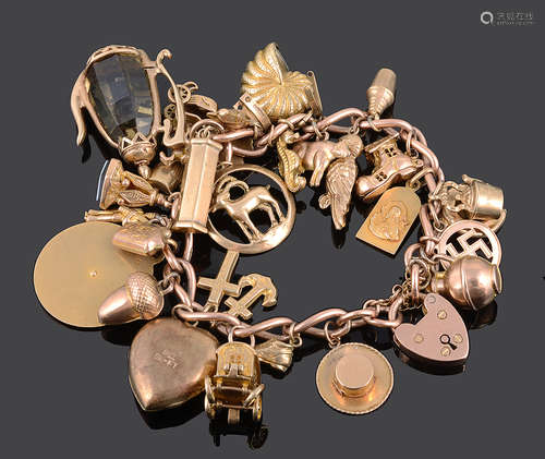 A heavy 9ct rose gold curb link charm bracelet