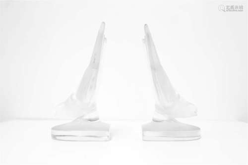 Pairs of crystal bookends. Lalique, XX Century. H cm 15