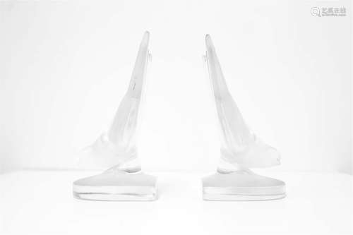 Pairs of crystal bookends. Lalique, XX Century. H cm 15