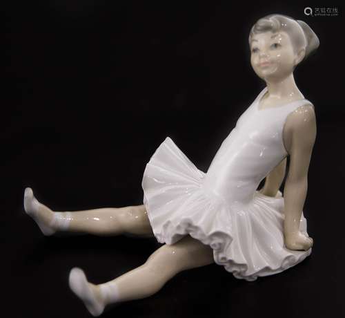 Porcelain statuette, branded NAO, Spain. Ballet dancer sitting. H Cm 15