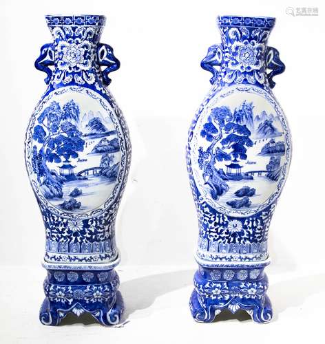 Pair of porcelain vases with base. Medallion both on the front and the back, with pictures of