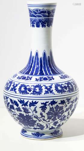 Bottle. White background with blue flowers decorations. China, 20th century. H Cm 40