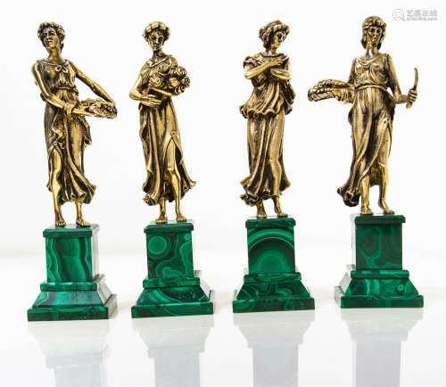 4 statuettes representing the 4 seasons. In vermeil silver, malachite base. H Cm 21
