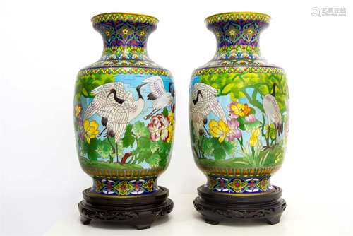 Pair of porcelain vases with bird decorations, China, XX Century, con base. H cm 45