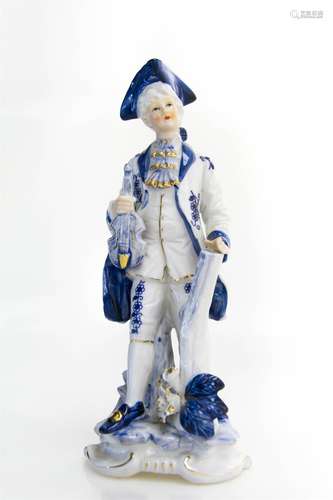 Porcelain statuette in blue and white. XX Century. Violinist