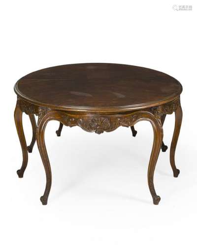 A French Louis XV-style oak dining table