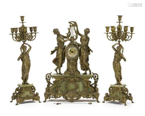 A gilt metal figural clock and garniture set
