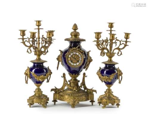 A porcelain and gilt bronze clock and garniture set
