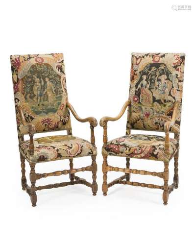 A pair of carved walnut armchairs