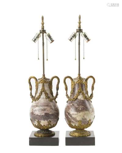 A pair of gilt bronze-mounted marble lamps