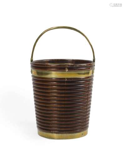An English mahogany and brass bucket