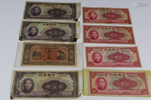 A Group of Eight Chinese Paper Currencies.