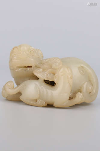 A Chinese Carved Jade Foo-Dog