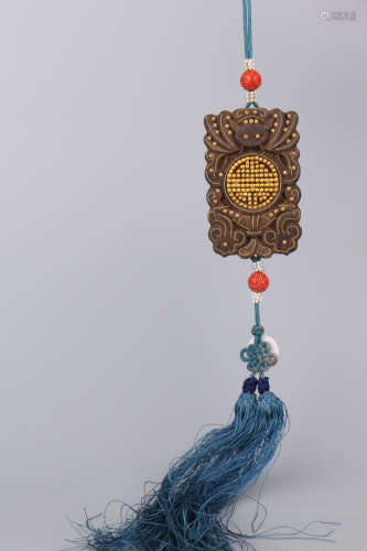 A Chinese Carved Agar-Wood Fasting Pendant