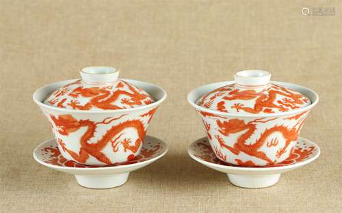 A Pair of Chinese Iron-Red Porcelain Tea Cups with Covers and Dishes