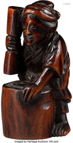 A Japanese Carved Boxwood Figural Netsuke, Edo p