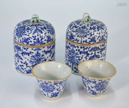 A pair of Chinese blue and white wine cups and lidded warmers