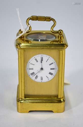 A miniature lacquered brass carriage clock