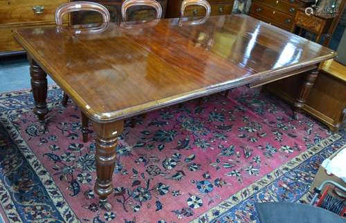 A 19th century mahogany extending dining table