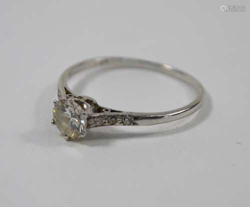 A white metal set diamond ring