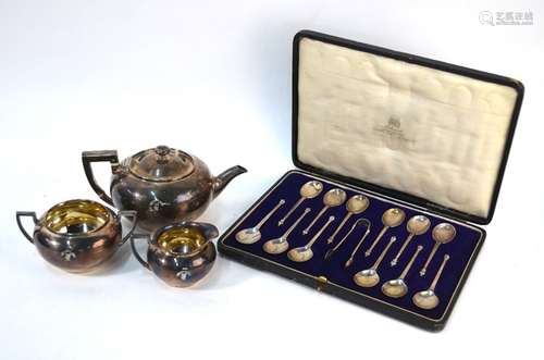 A cased set of twelve silver teaspoons with tongs and other items