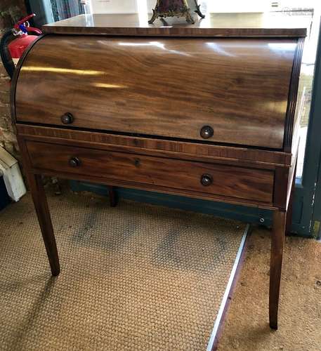 A 19th century mahogany cylinder top writing desk