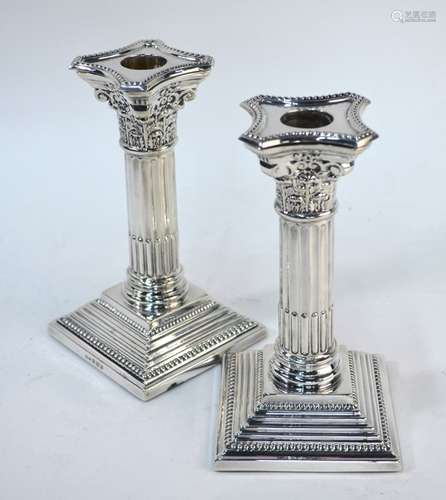 Pair of loaded silver Walker & Hall candlesticks