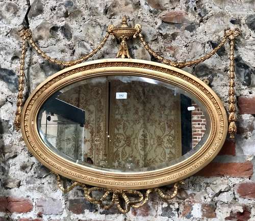 A late 19th century Adam style giltwood mirror