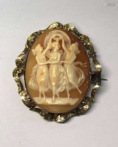 A large antique shell cameo brooch featuring the Three Graces