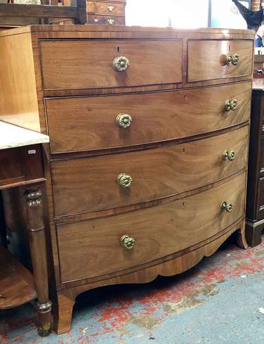 Bow front 19th century mahogany chest of two short over three long drawers on splayed feet