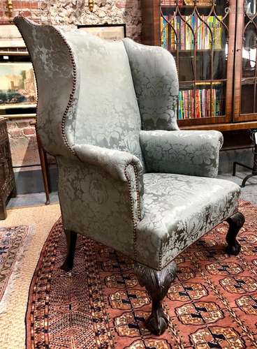 A 19th century George II style wingback armchair