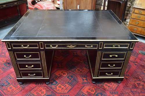 An antique gilt metal mounted ebonised oak partners desk in the Louis XVI taste