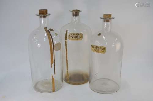 Three large vintage glass perfumers/chemist's jars