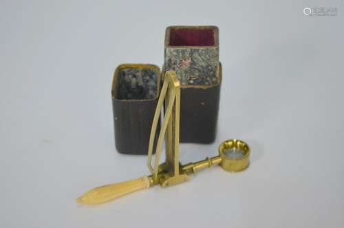 An early 19th century lacquered brass folding pocket microscope