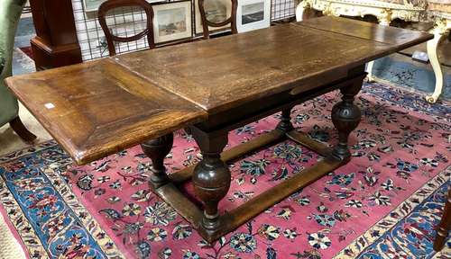 A 17th century Dutch oak draw-leaf dining table