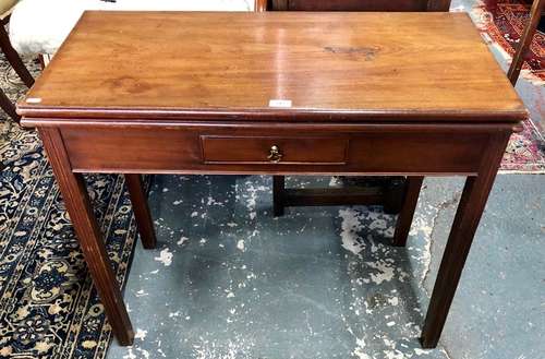 A George III mahogany fold-over tea table